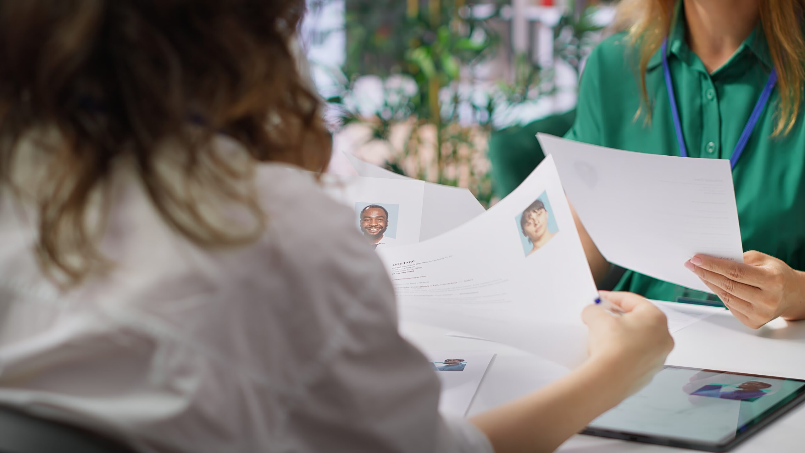 Human resources staff evaluating candidates resume in the selection process
