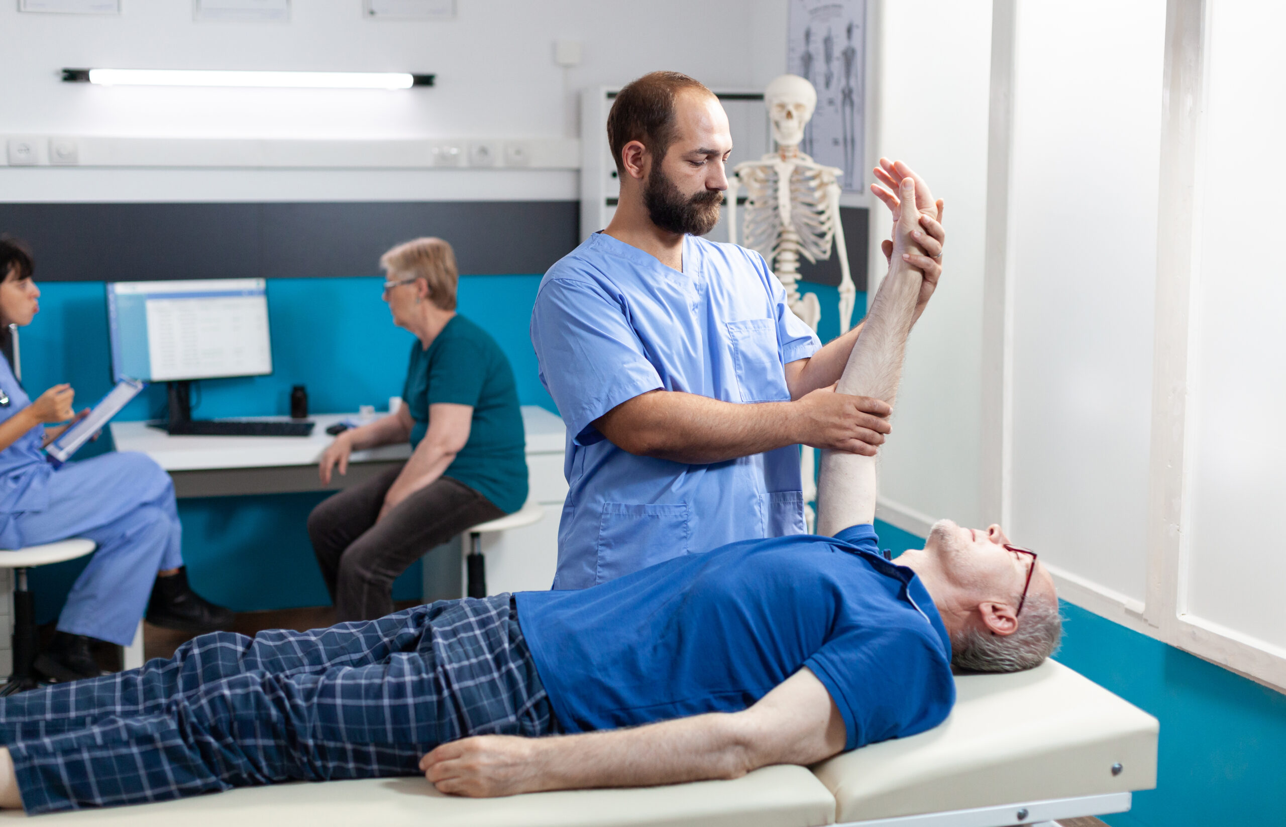 Chiroptractor doing osteopathic massage on aged patient
