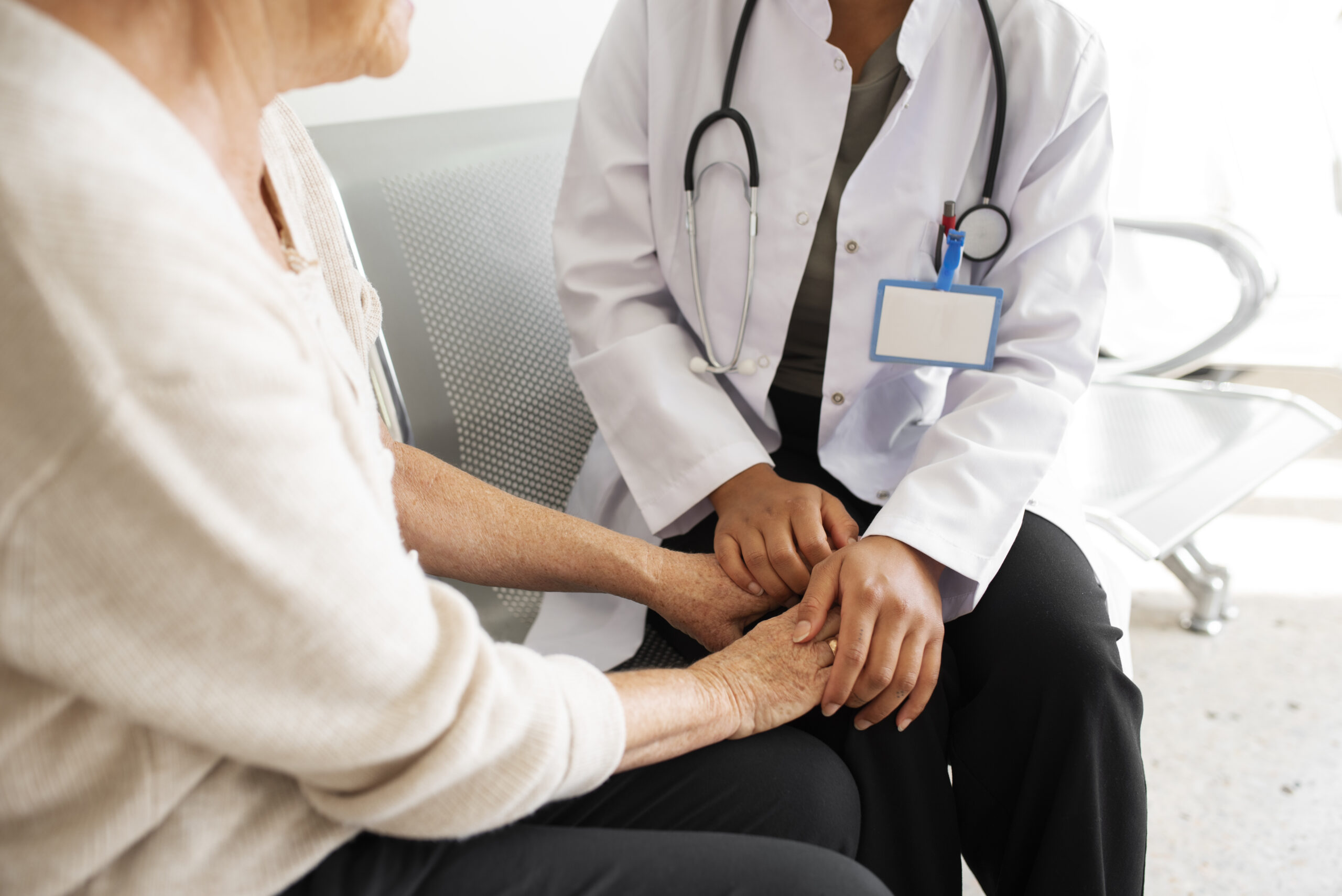 doctor-talking-patient-side-view